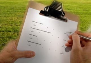 Customer fills out a satisfaction survey after receiving a sprinkler repair in Coral Gables, FL